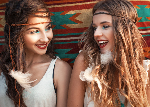 Portrait of two beautiful hippie girls having fun and laughing,  - Photo, image