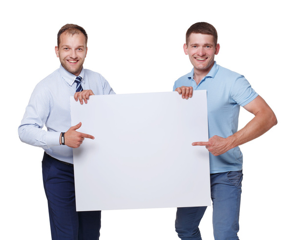 Two businessmen carry and show blank advertising board, isolated - Fotó, kép