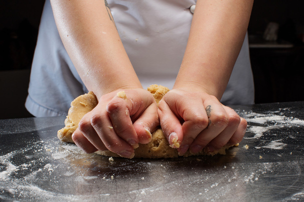 Woman hands kneading dough. - 写真・画像