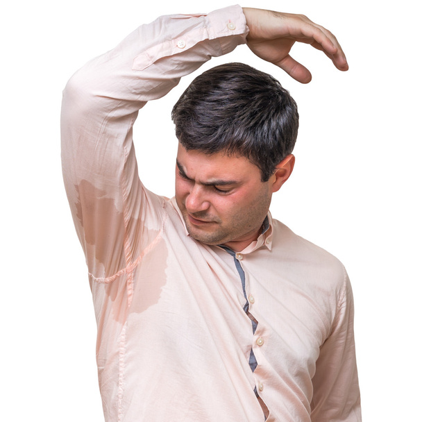 Man with sweating under armpit in pink shirt isolated on white - Photo, Image
