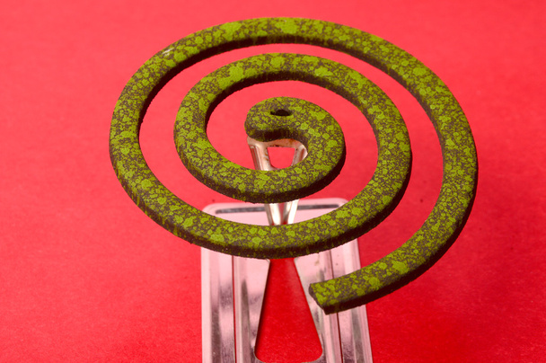  Burning mosquito coil, Mosquito coil is mosquito-repelling incense, usually shaped into a spiral, Anti mosquito made by neem leaves green color - insecticides - Photo, Image