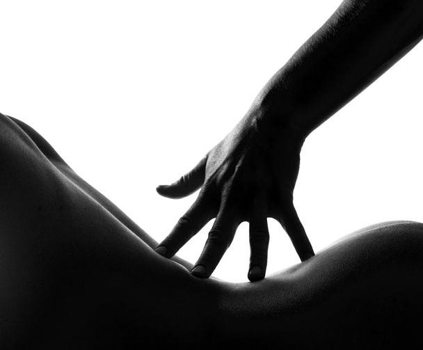 Nude woman body touched by mans hand - Zdjęcie, obraz