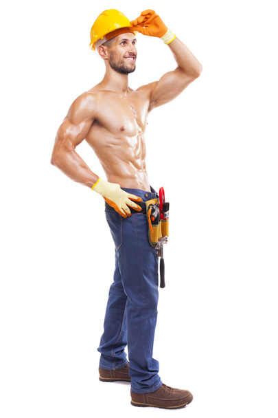 Full length of a muscular young worker - Foto, Bild