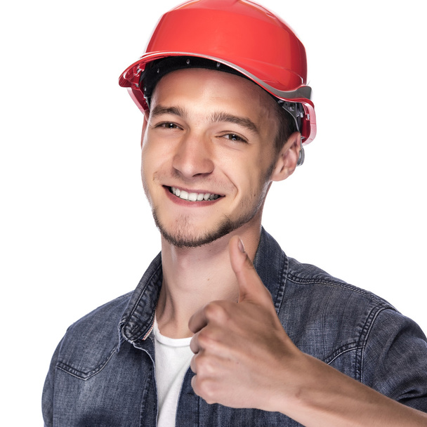 Young man in a construction helmet. - Photo, Image