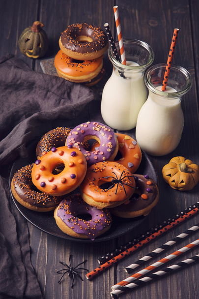 Halloween donuts on a dark wooden background - Valokuva, kuva