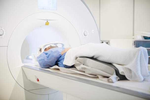 Patient Wearing Head Coil During MRI Scan In Hospital - Φωτογραφία, εικόνα
