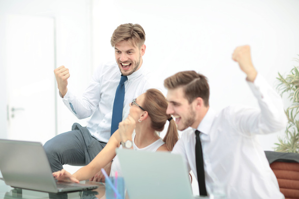 Successful business team with arms up at the office - 写真・画像