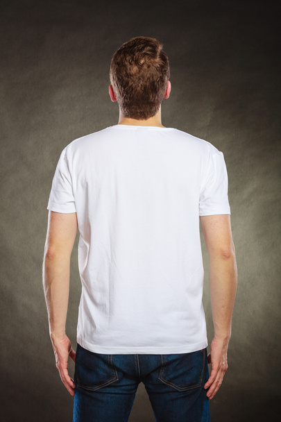 Back view man guy in blank shirt with copy space. - Zdjęcie, obraz