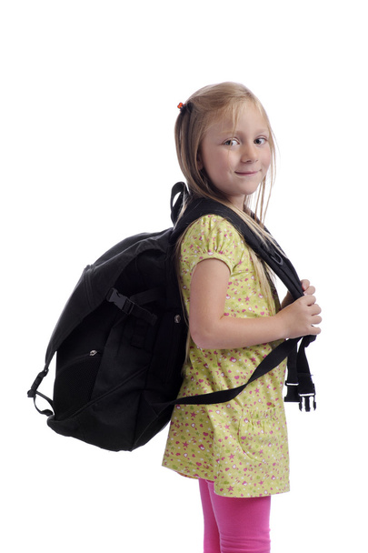 Little girl with heavy backpack - Фото, изображение