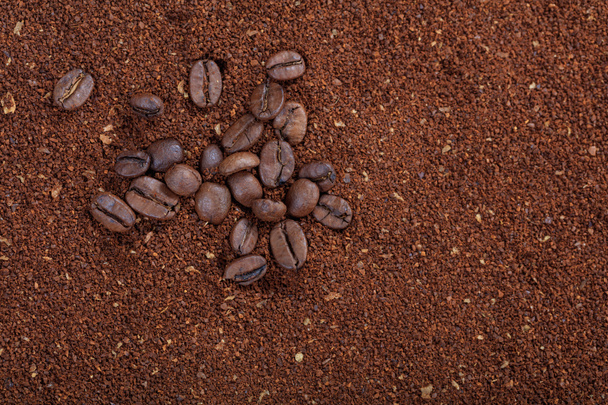 Ground coffee background and coffee beans - Photo, Image