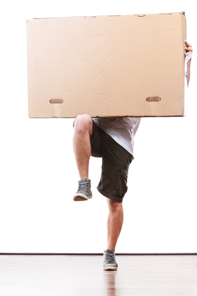 Delivery man holding a paper box. - 写真・画像