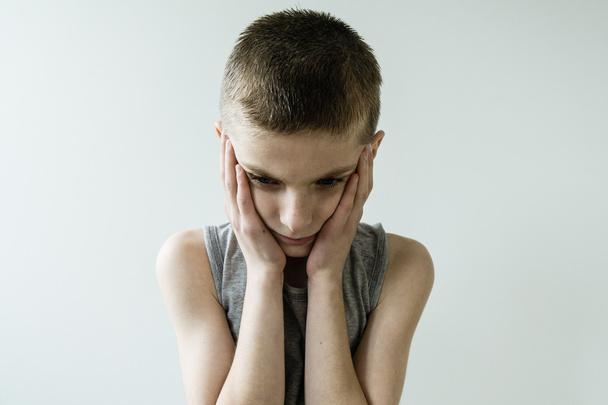 Troubled Young Boy with Head and Hands - Photo, Image