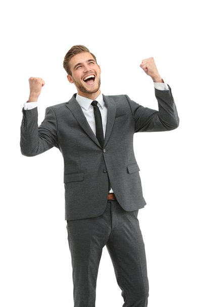 Businessman celebrating  with his fists raised in the air and a - Photo, image