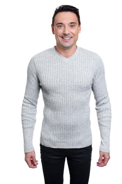 sexy fashionable man in sweater and jeans - Foto, Imagen