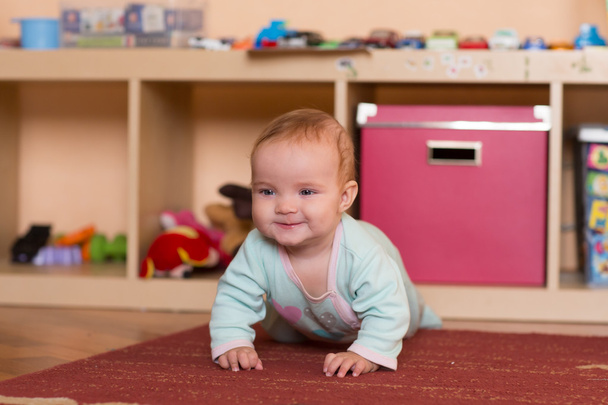 Baby playing and crawling, making faces,  on the floor. - Фото, зображення
