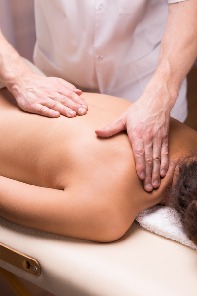 Perfect manual skills of a professional masseur - Foto, imagen
