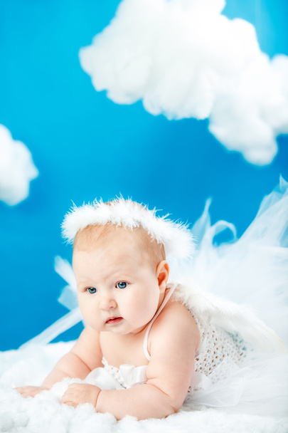 the baby as the angel soaring in clouds - Fotó, kép