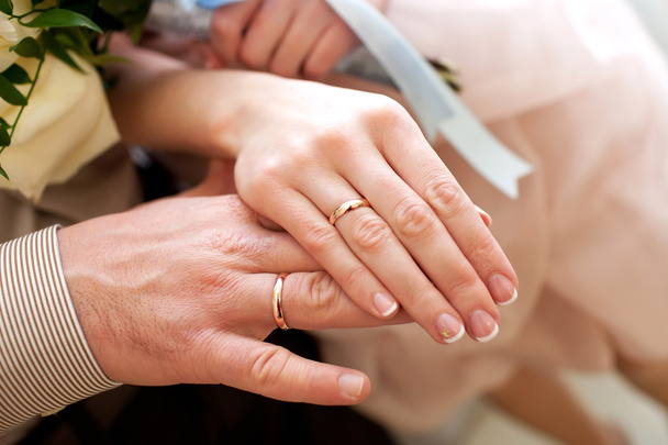 Bride and groom hands with wedding rings - Fotó, kép