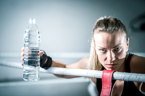 Boxer girl drinking water - Foto, Imagen