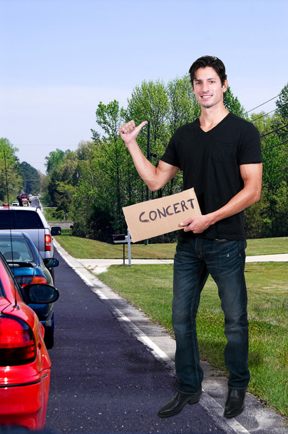 Man Hitch Hiking to a Concert - Photo, Image