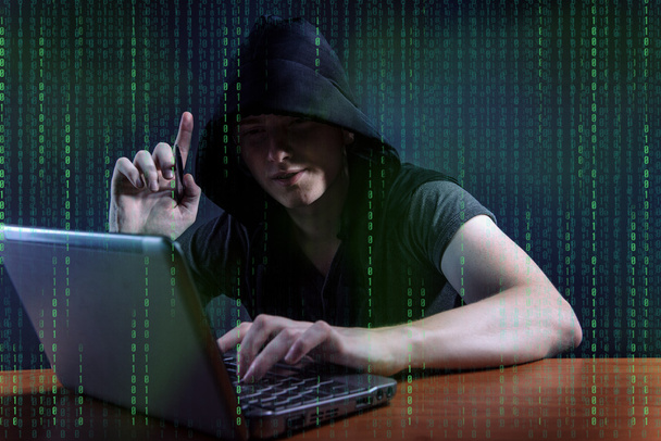 Young hacker in digital security concept - Фото, изображение