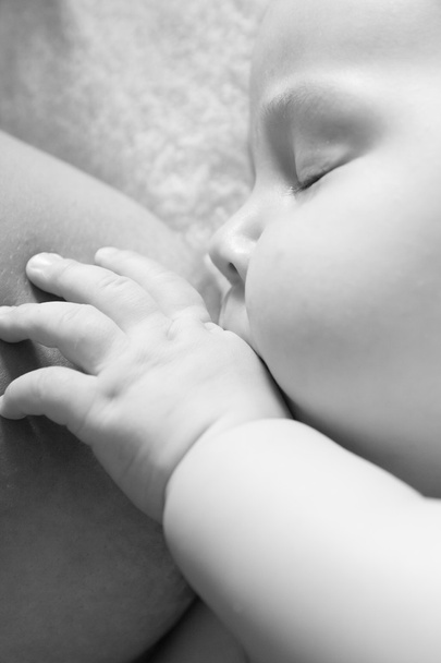 Mother is breastfeeding. Baby suckles - Фото, зображення