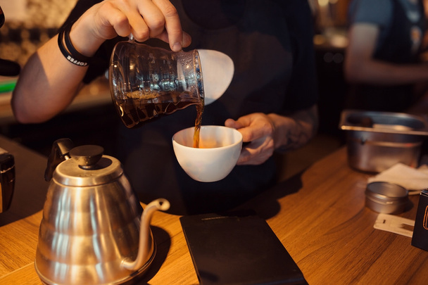 Barista at work in a coffee shop - Foto, Bild