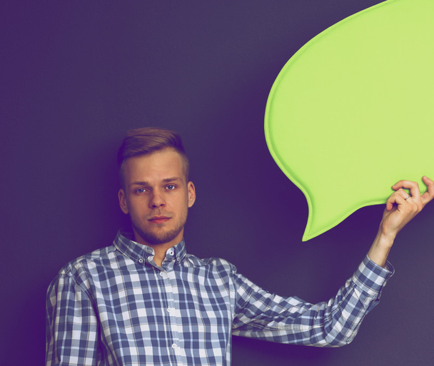 Man holding white blank speech bubble with space for text, - 写真・画像