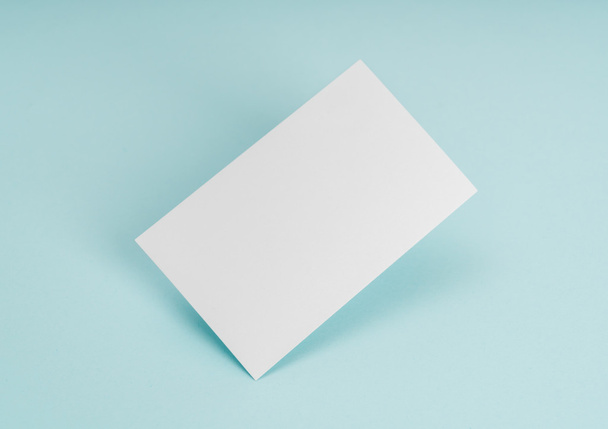 Blank business card on blue background . - Photo, Image