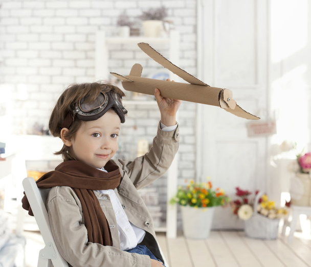 boy with airplane in hand - Photo, Image