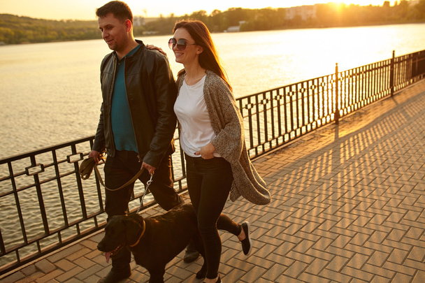 Young couple with dog in city - Foto, Imagem