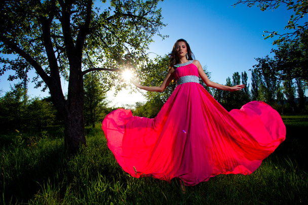 Woman in a long pink dress - Fotoğraf, Görsel