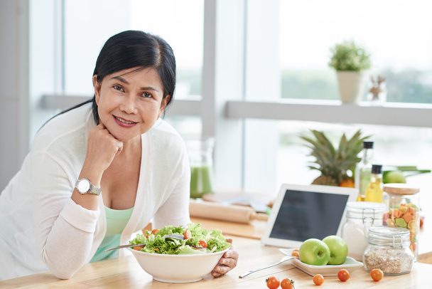 woman eating healthy salad at home - Photo, Image