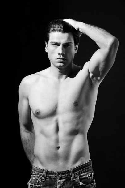 Shirtless muscular man in jeans in black and white - Φωτογραφία, εικόνα