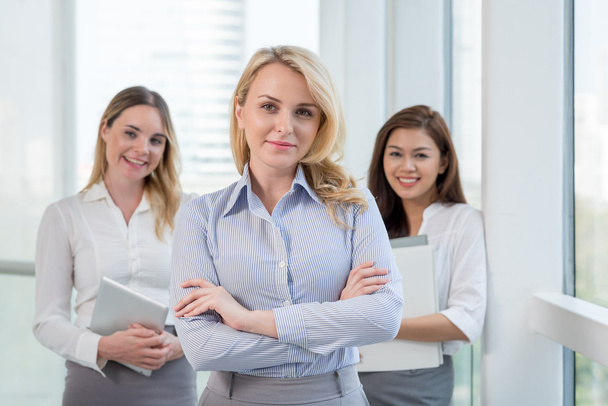businesswoman and team standing in office - Photo, Image