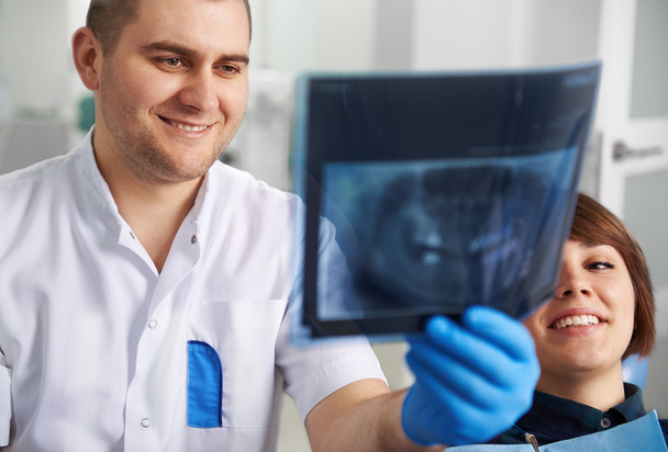 Dentist with patient in clinic  - Fotó, kép