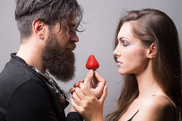 sexy couple eating red strawberry - Zdjęcie, obraz