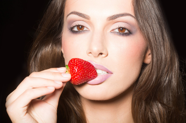 sexy woman eating red strawberry - Photo, Image