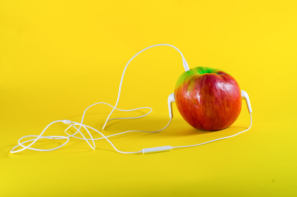 Apple and headphone - Photo, Image