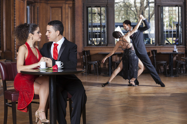 Loving couple and tango partners in cafe - Foto, imagen