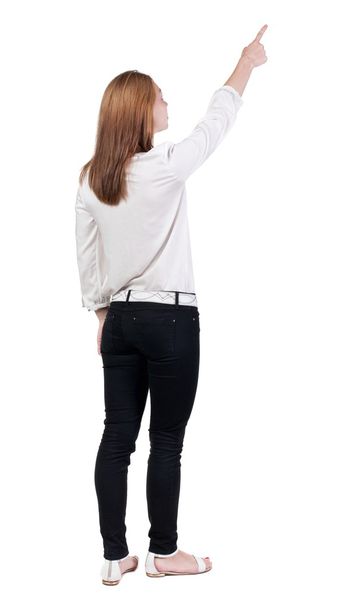 Back view of  pointing woman. - Фото, зображення