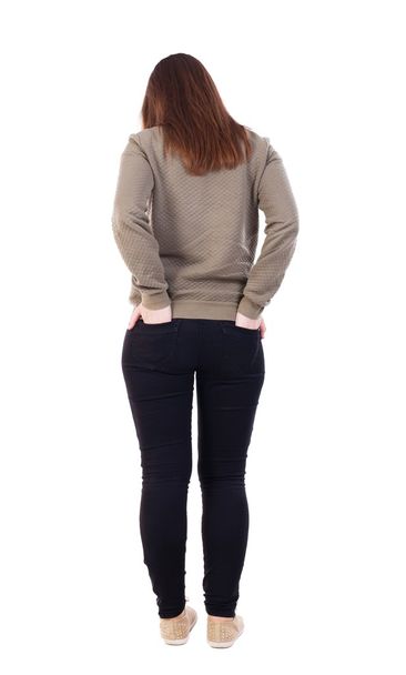back view of standing young beautiful  woman in jeans. - Фото, зображення