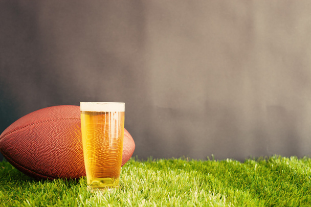 Football and beer glass - Foto, imagen