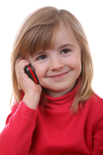 The beautiful young girl speaks by phone - Φωτογραφία, εικόνα