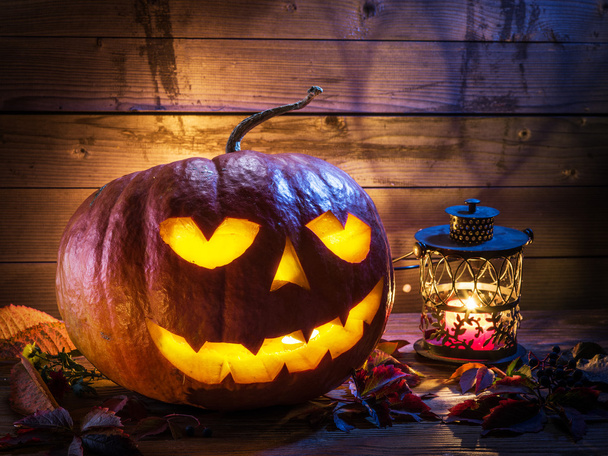 Grinning pumpkin lantern or jack-o'-lantern is one of the symbols - Foto, imagen