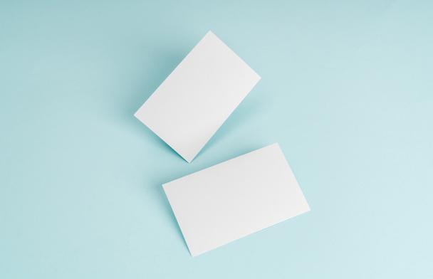 Blank business card on blue background . - Foto, afbeelding