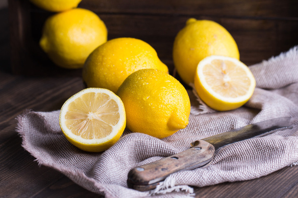 Group of fresh lemon on an old vintage wooden table - Photo, Image