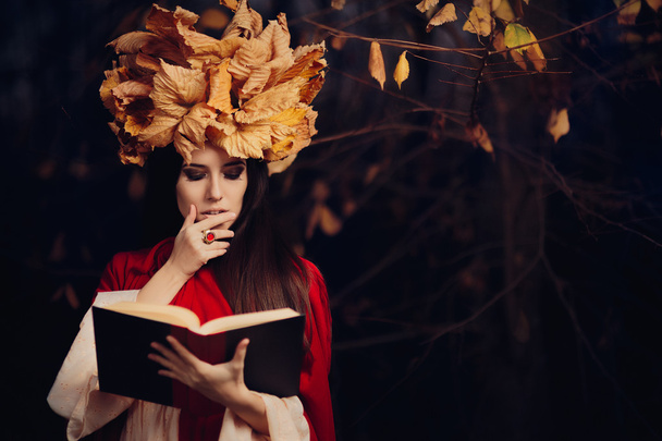 Woman With Autumn Leaves Crown Reading a Book - Foto, imagen