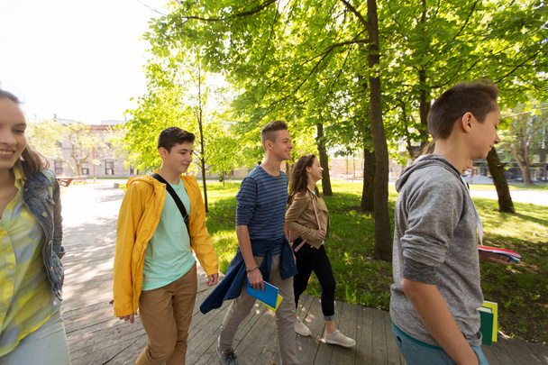 group of happy teenage students walking outdoors - Foto, immagini