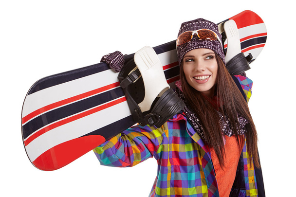 Beautiful woman with a snowboard - 写真・画像